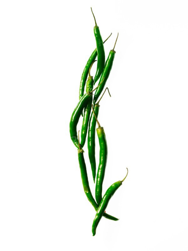 Studio shot of green chili peppers. Photo : David Arky