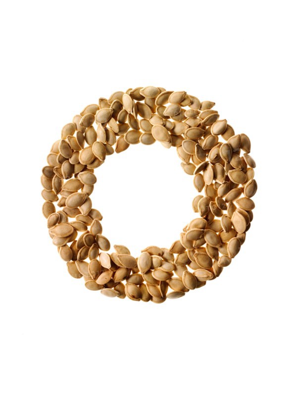 Studio shot of Pumpkin Seeds on white background. Photo : David Arky