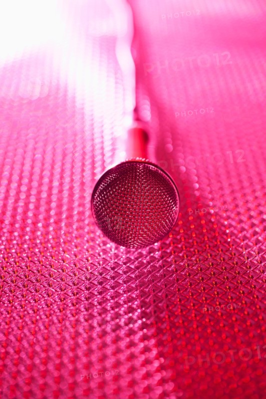 Close up of microphone lying on stage. Photo: Daniel Grill