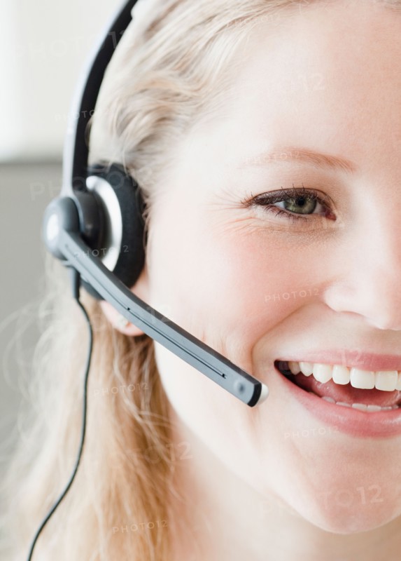 Young woman wearing headset. Photo: Jamie Grill