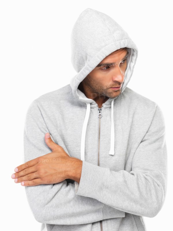 Young man in hoodie looking away. Photo : momentimages
