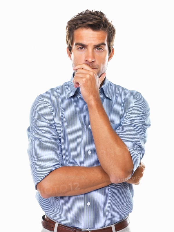 Portrait of business man standing and wondering. Photo : momentimages
