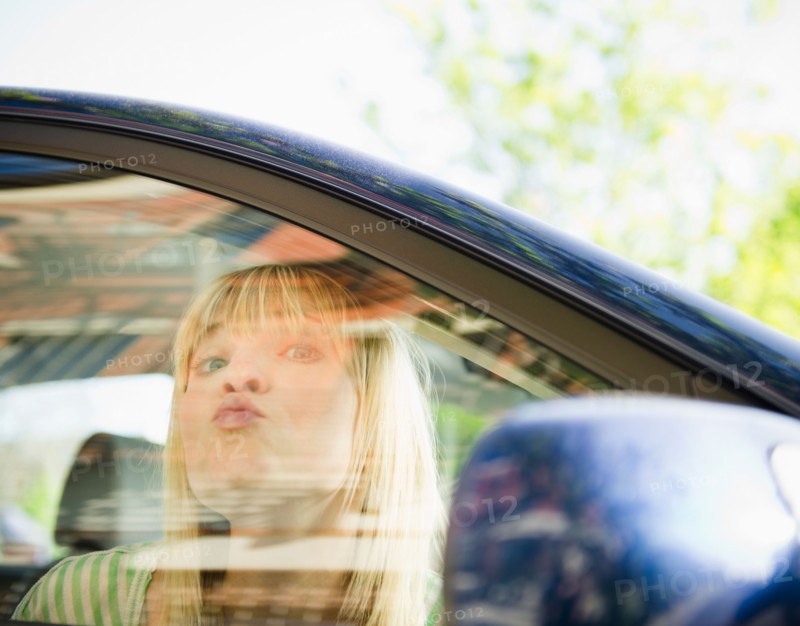 USA, New York, Williamsburg, Brooklyn, Portrait of woman in car. Photo: Jamie Grill