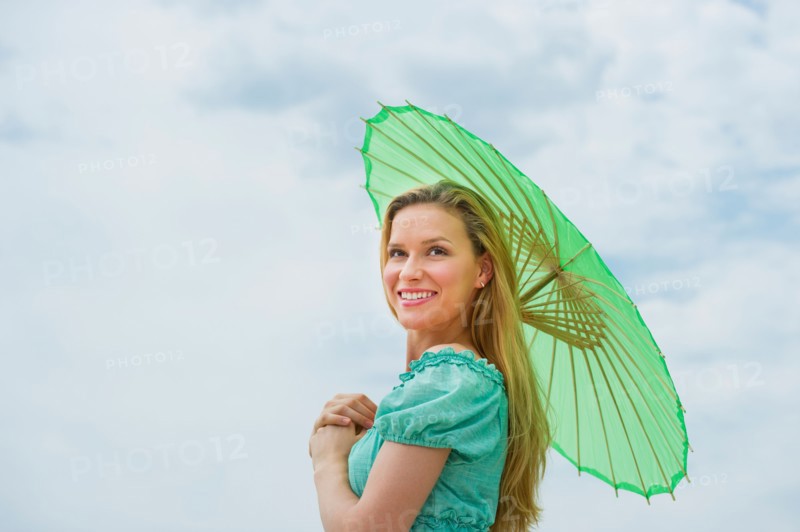 Woman holding parasol.