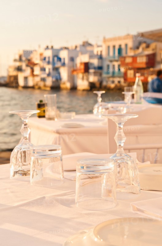 Greece, Cyclades Islands, Mykonos, Set tables by sea.
