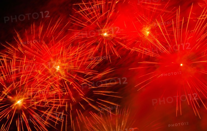 Fireworks explosion against night sky.