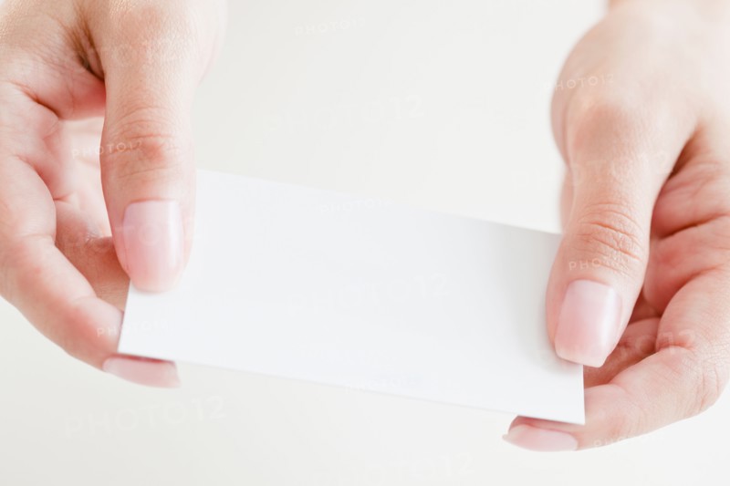 Close up of woman's hands holding credit card. Photo : Jamie Grill