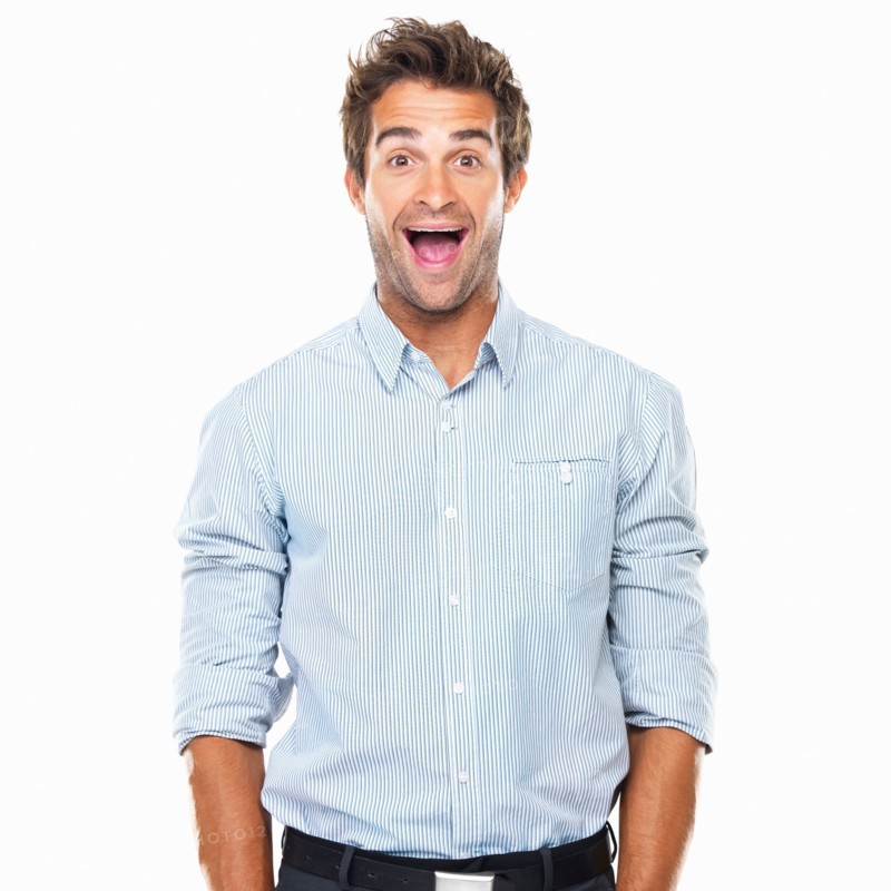 Portrait of cheerful business man with wide grin standing. Photo : momentimages