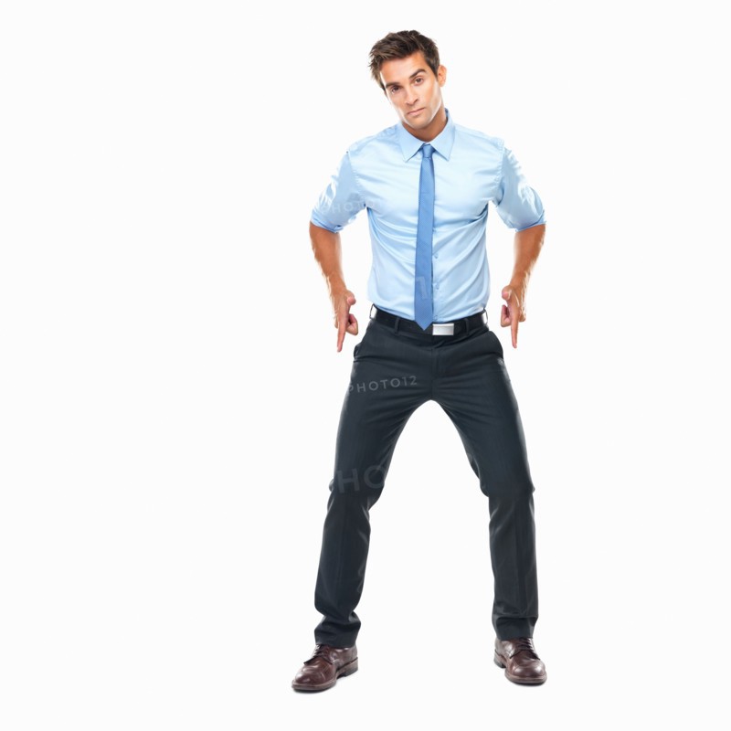 Studio shot of smart business man holding out gun shaped hands. Photo: momentimages