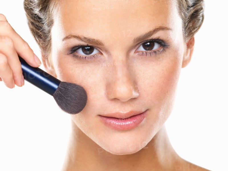 Studio portrait of beautiful woman blushing cheeks. Photo: momentimages