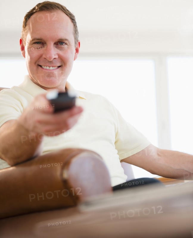 Man holding remote control. Photo: Jamie Grill