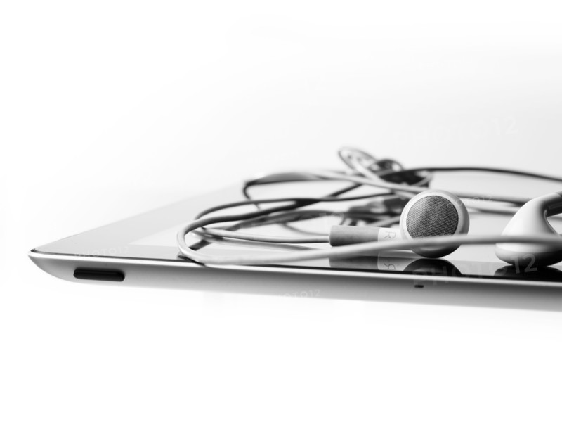 Studio shot of digital tablet and earphones. Photo : David Arky