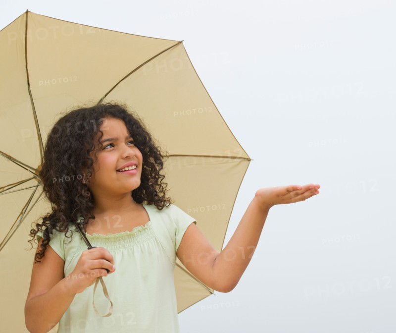 Girl (8-9) with umbrella.