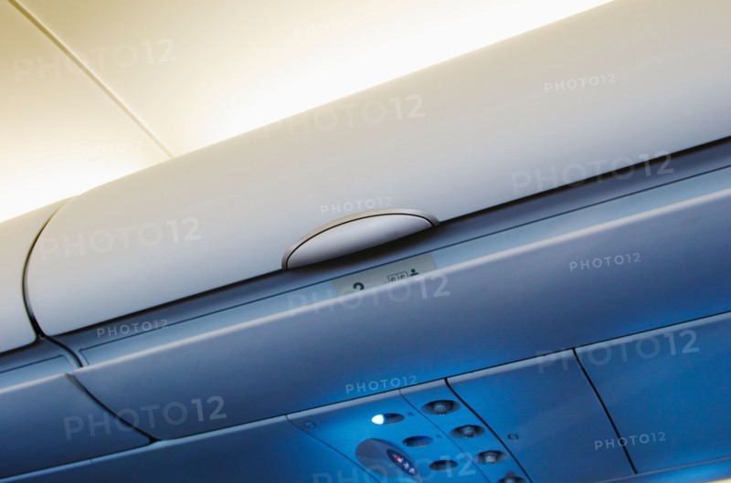 Overhead storage compartment in airplane.