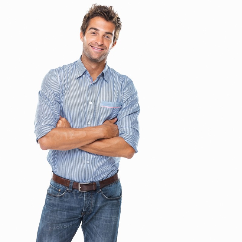 Studio shot of young confident man smiling. Photo: momentimages