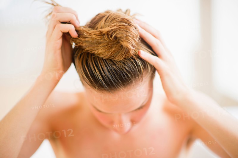 Woman washing hair.
