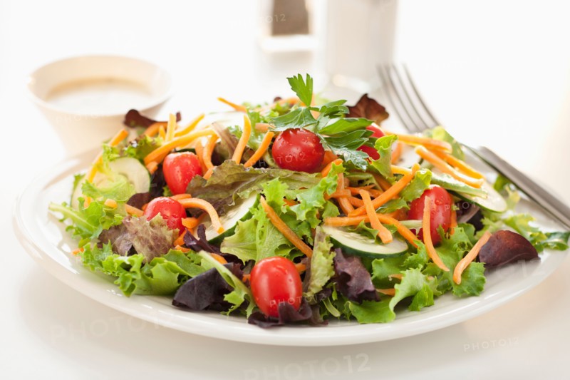 Fresh salad on plate.