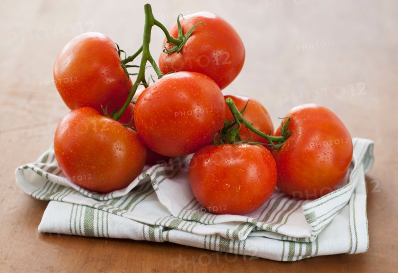Fresh tomatoes on table.