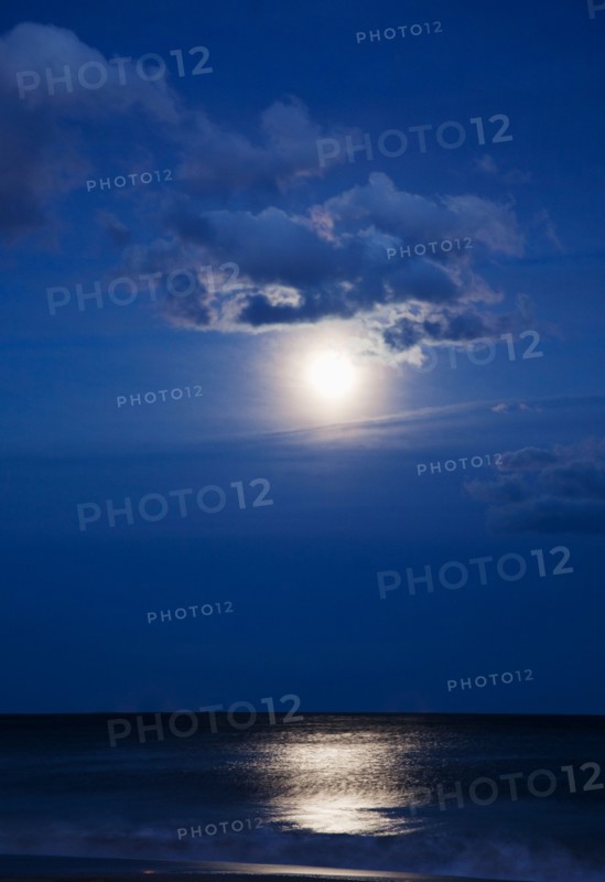 USA, New York, Queens, Rockaway Beach, Landscape with sea and moonlight at night. Photo: Jamie Grill