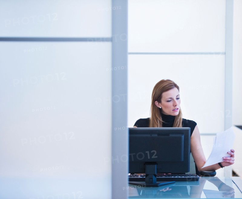 Young woman working in office. Photo: Daniel Grill