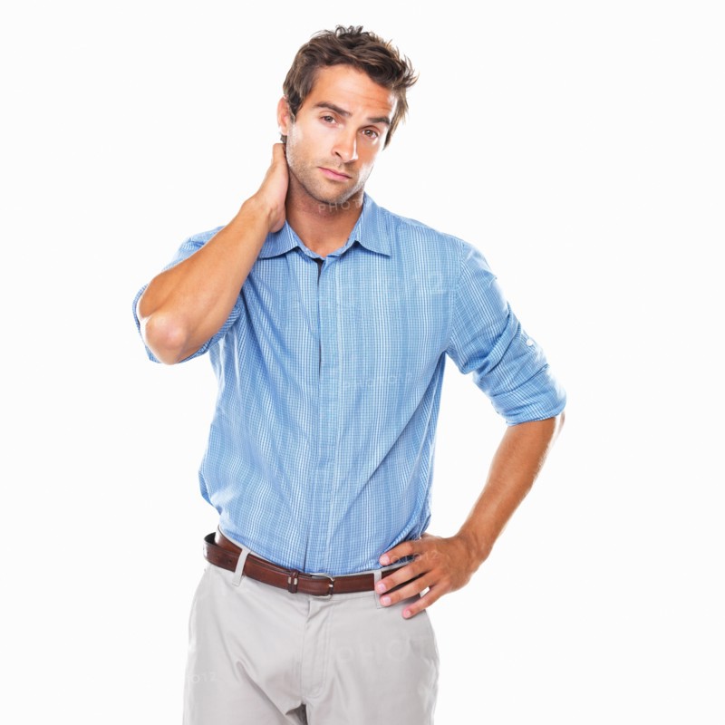 Portrait of business man standing with hand behind neck. Photo : momentimages