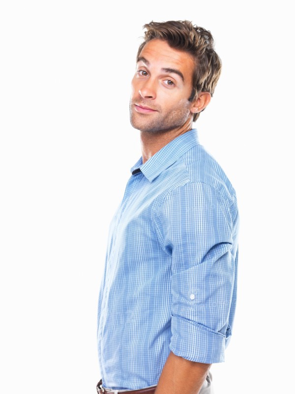 Studio portrait of young business man smiling. Photo: momentimages