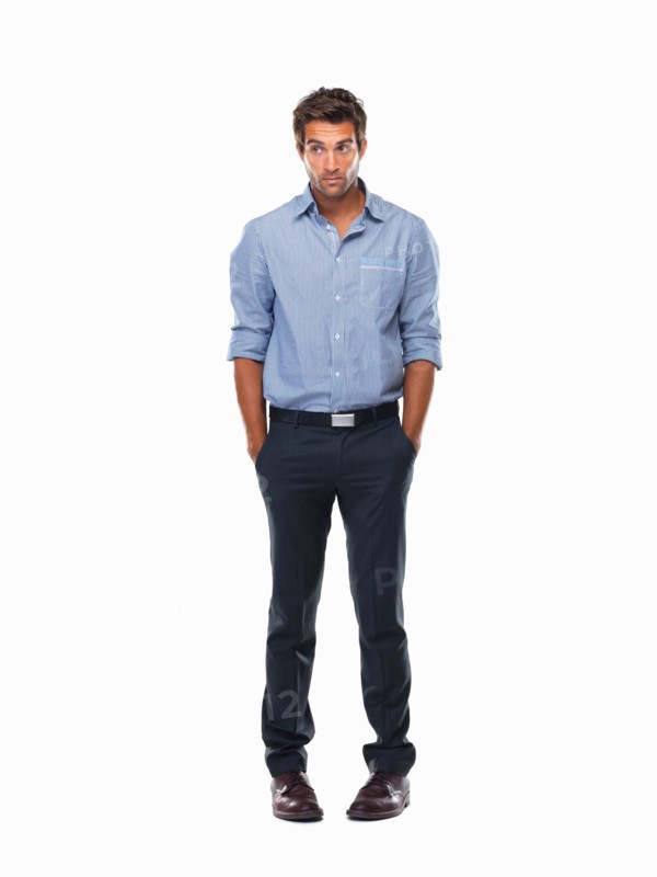 Worried executive standing with hands in pockets against white background. Photo : momentimages