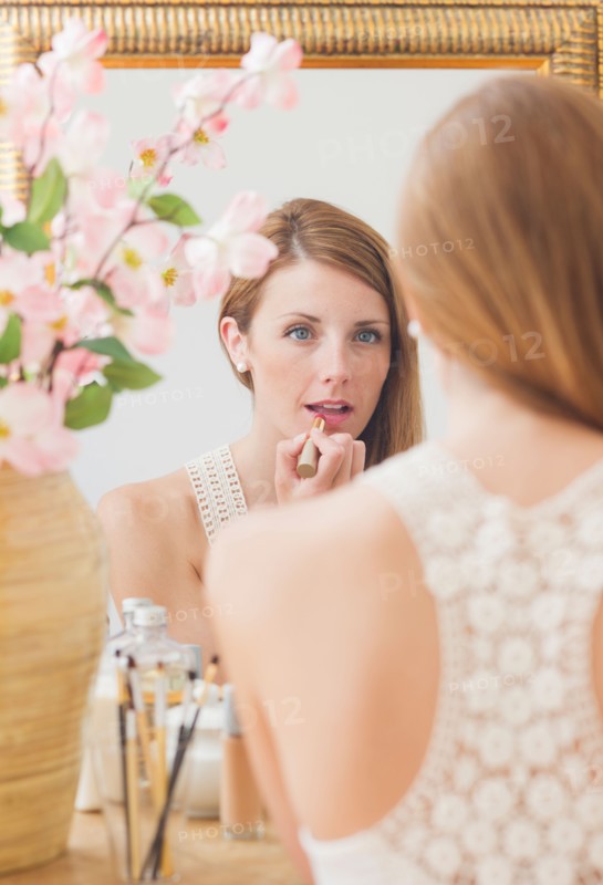 Young woman in front of mirror. Photo: Daniel Grill