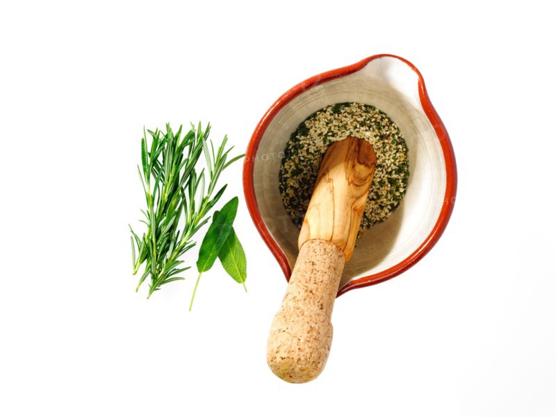 Studio shot of herbs and mortar and pestle. Photo: David Arky