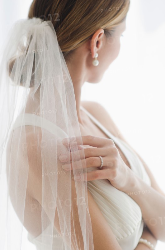 Bride wearing veil.
