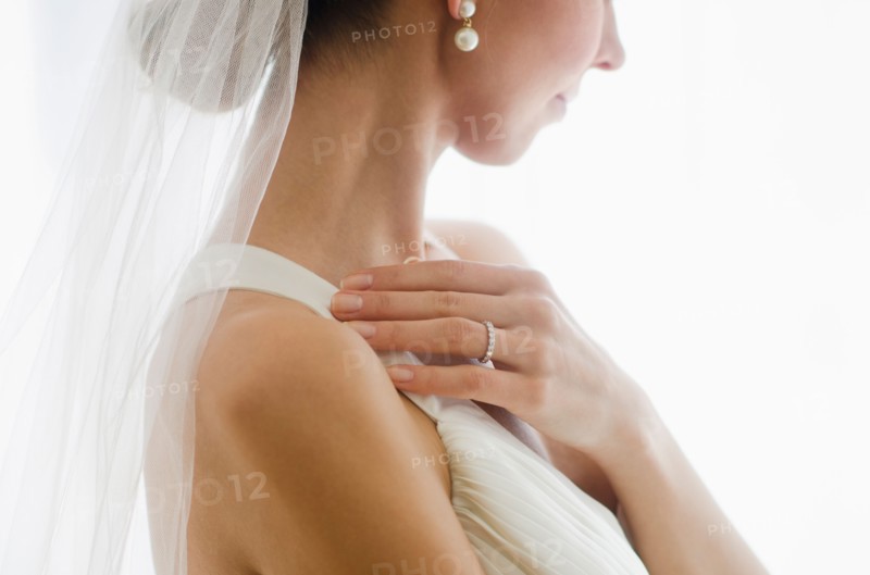 Bride wearing veil.