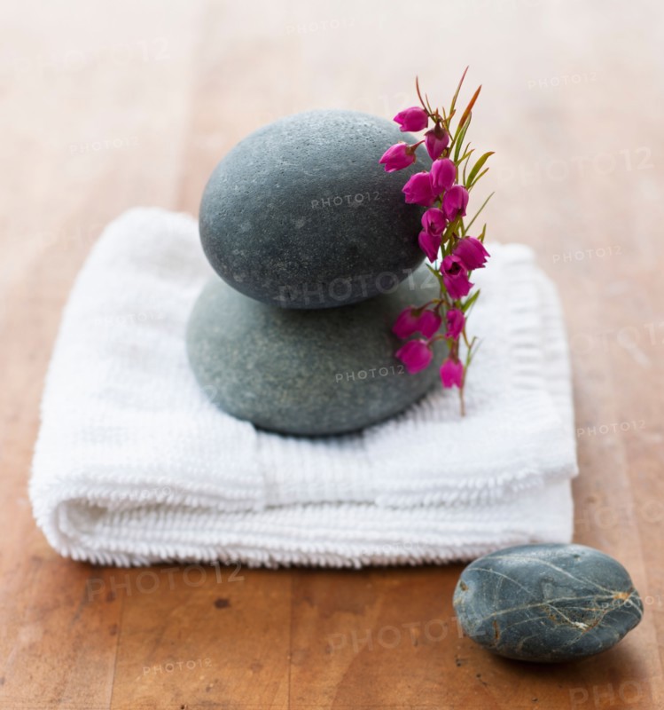 Stones on towel at spa.
