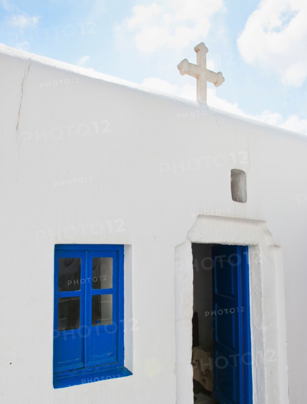 Greece, Cyclades Islands, Mykonos, Church with cross on roof.