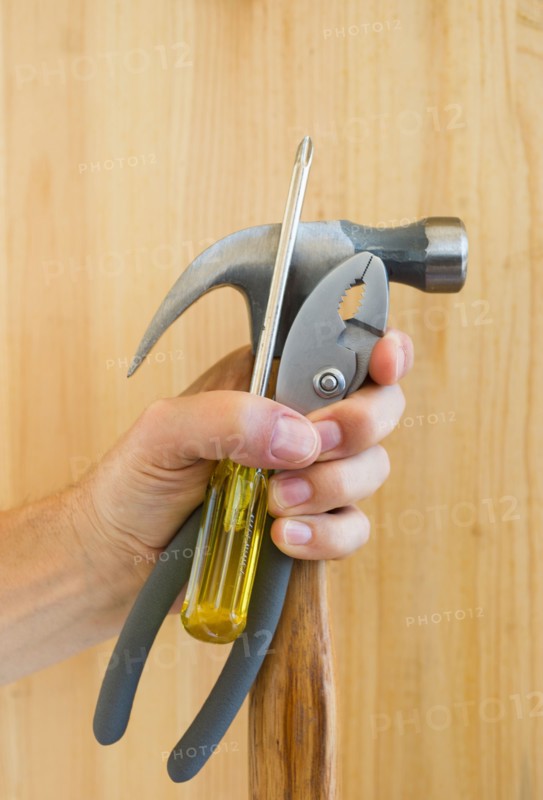 Hand holding tools.