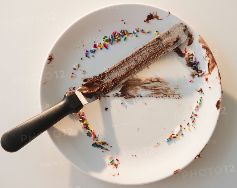 Close up of empty plate with rests of chocolate and sprinkles. Photo : Jamie Grill