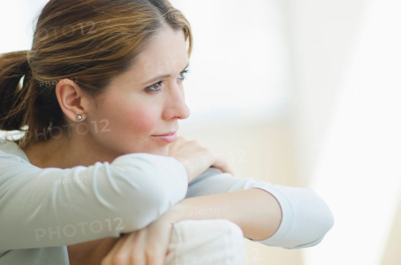 Pensive woman relaxing.