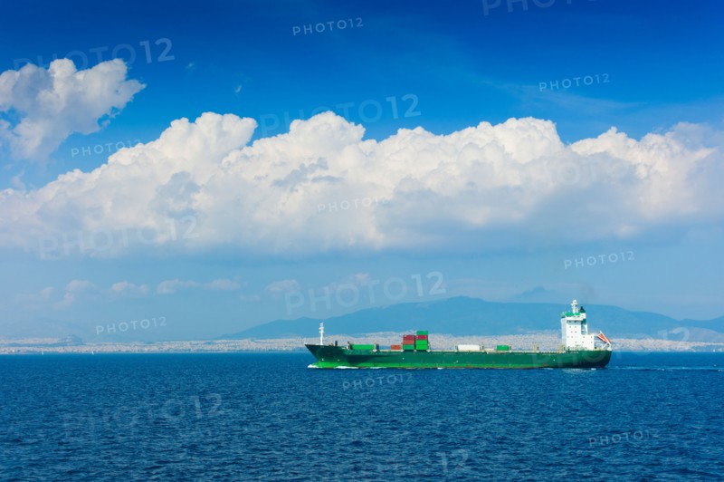 Greece, Container ship on Aegean Sea.