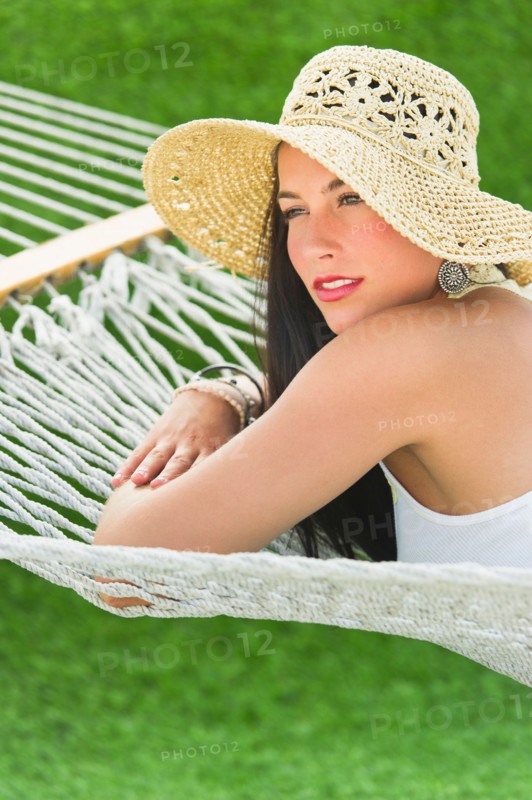 Woman relaxing in hammock.