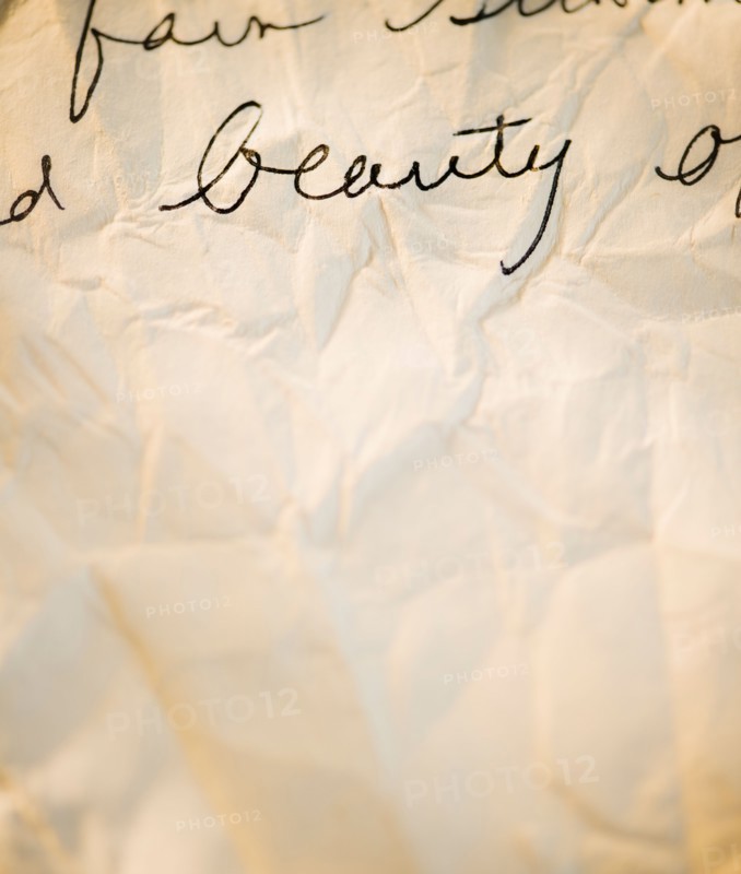 Close up of antique love letter on parchment . Photo: Jamie Grill