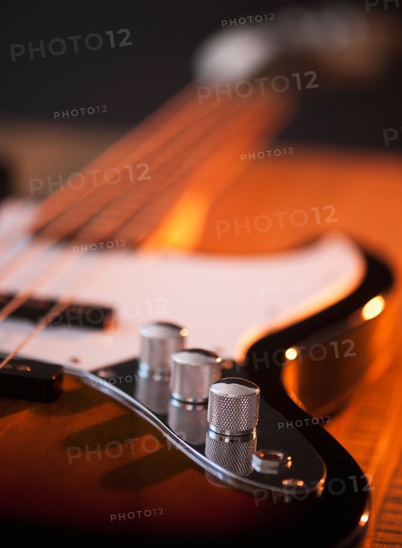Close up of volume knobs of bass guitar. Photo: Daniel Grill