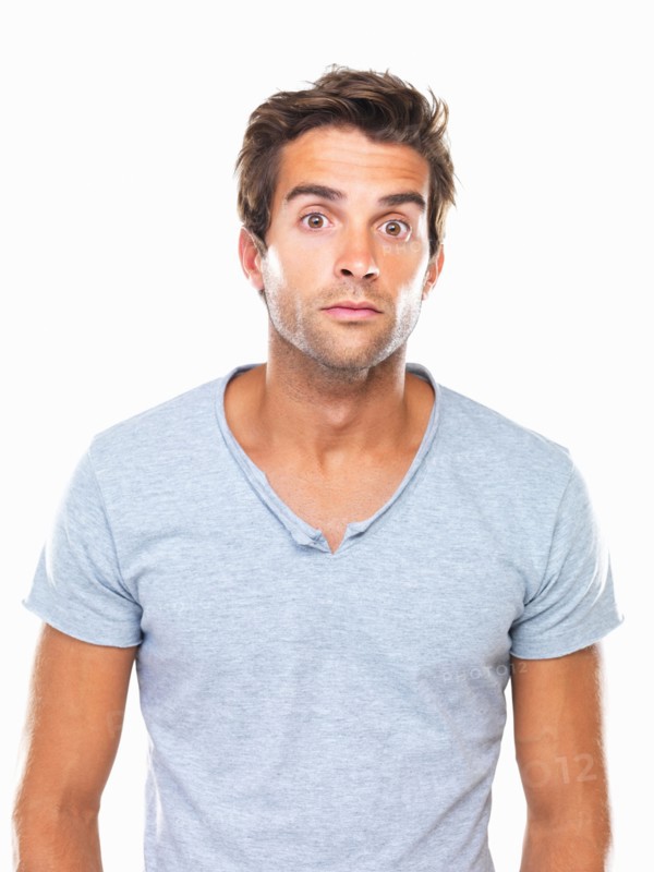 Studio portrait of man with eyes wide open. Photo: momentimages
