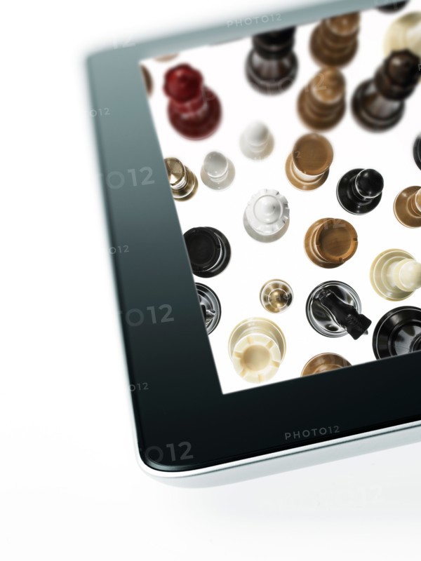 Studio shot of chess pieces on digital tablet. Photo: David Arky