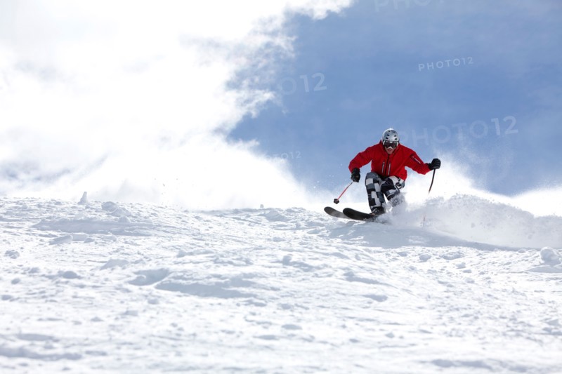 Male skier on fresh powder snow