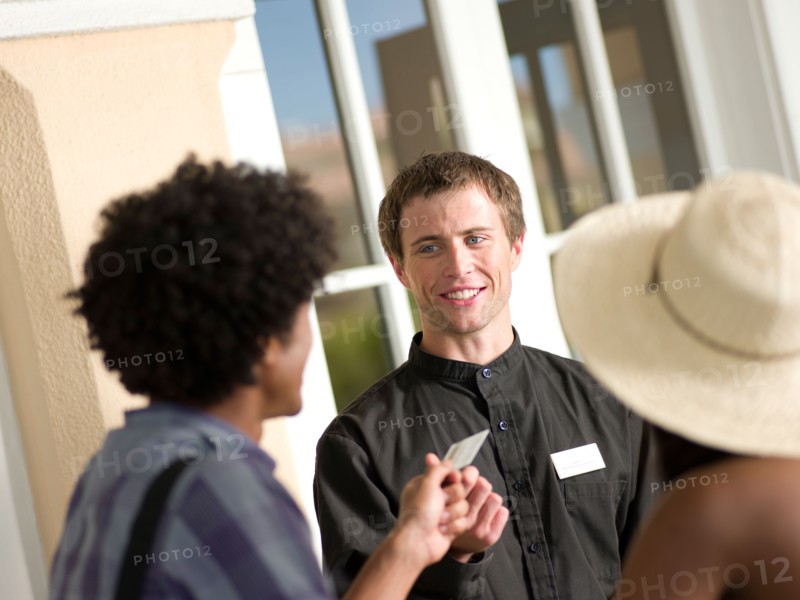 Couple checking in to hotel. Photo: db2stock