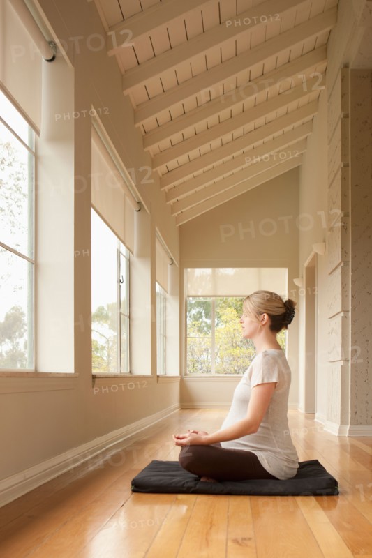Pregnant woman practicing yoga. Photo: Rob Lewine