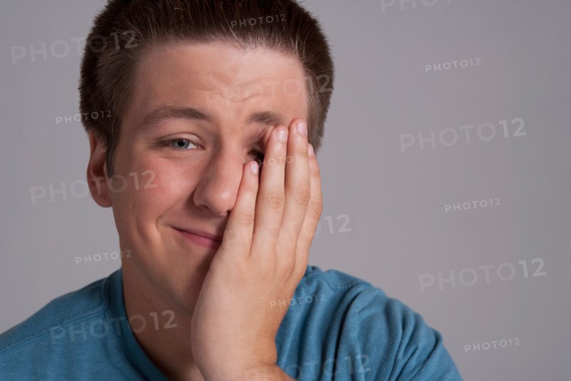 Portrait of sleepy teenager, studio shot. Photo: Rob Lewine