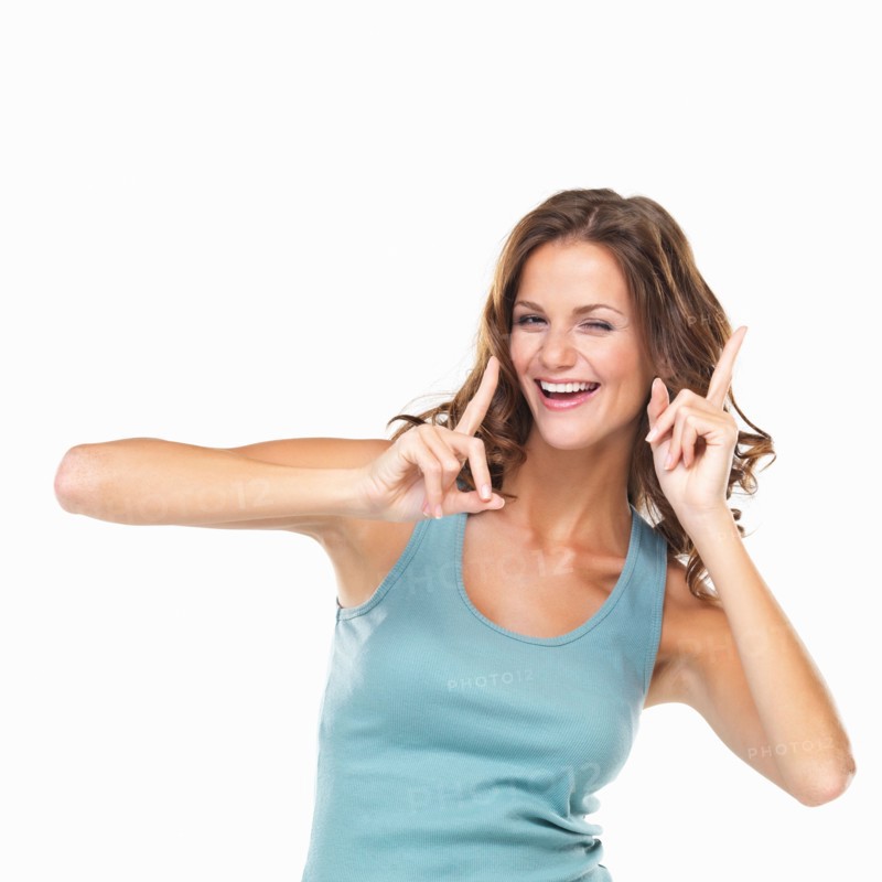 Studio portrait of attractive young woman gesturing and winking. Photo: momentimages