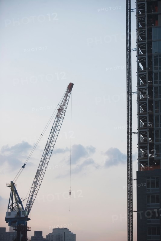 USA, New York State, New York City, Cranes against sky. Photo: fotog