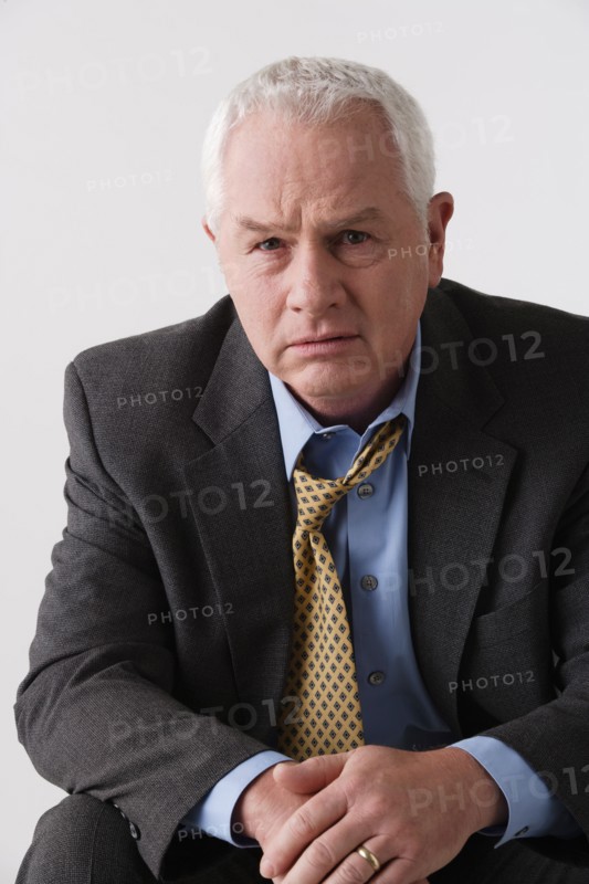 Portrait of senior businessman, studio shot. Photo : Rob Lewine