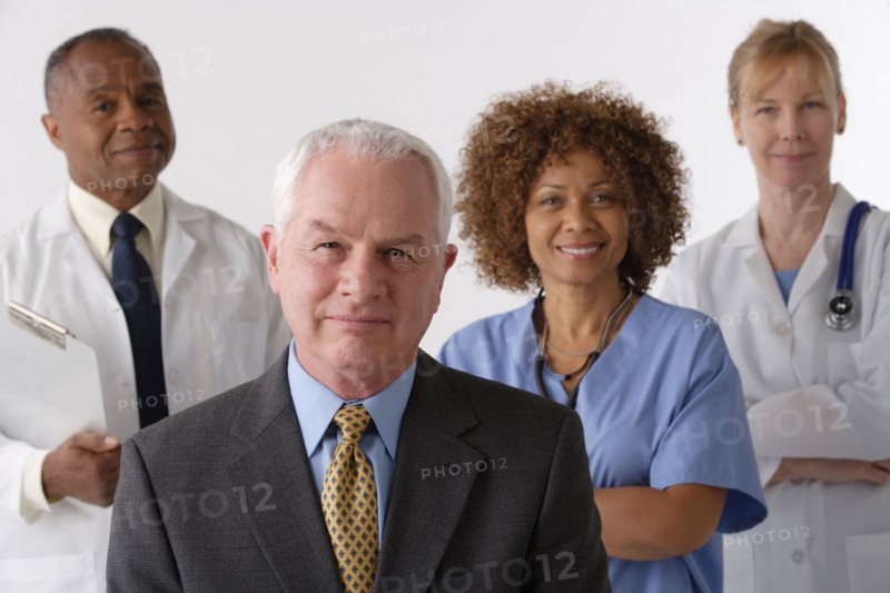 Portrait of four medical professionals, studio shot. Photo: Rob Lewine